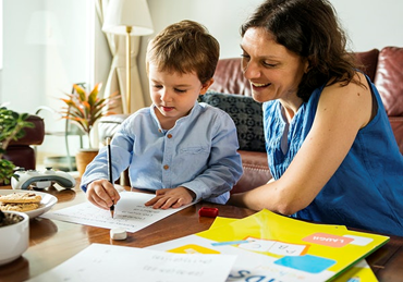 Mother helping the child with Behavior Therapy 