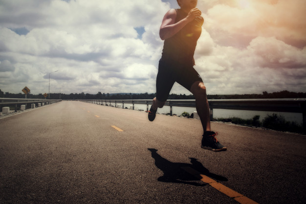 A man is doing physical exercise i.e. running and it will help him fight anxiety