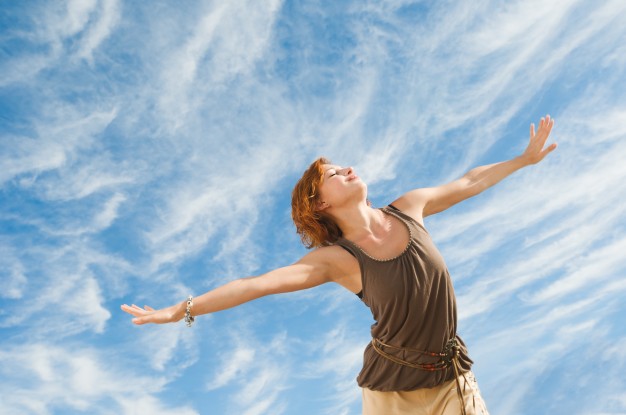 A woman is doing physical exercise i.e. Tai Chi and it will help her fight anxiety